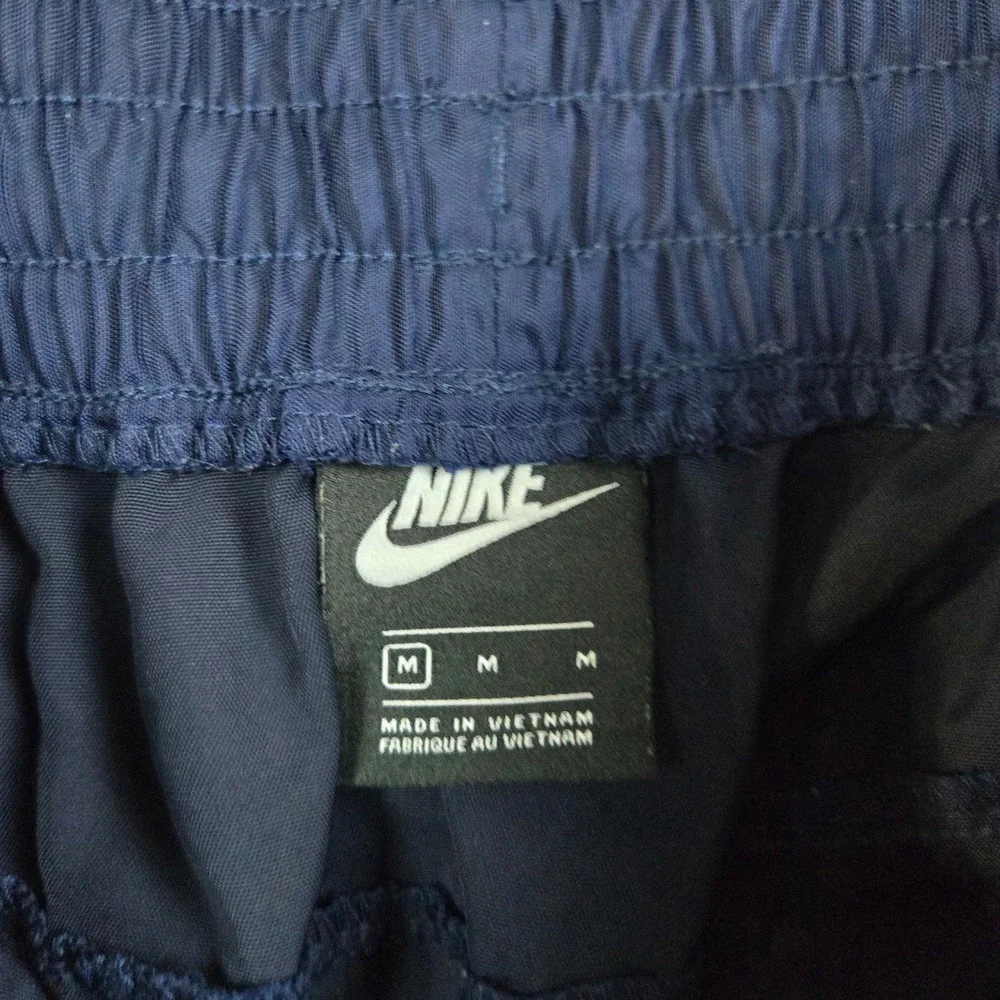 Nike‎ Track Pants Mens Medium Navy Blue Swoosh Logo Cuffed Joggers Sportswear
